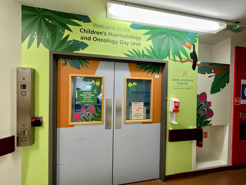 An image of the interior wall graphics and door graphics for the oncology unit.